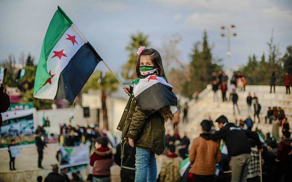 girl-holding-syrian-flag_1024