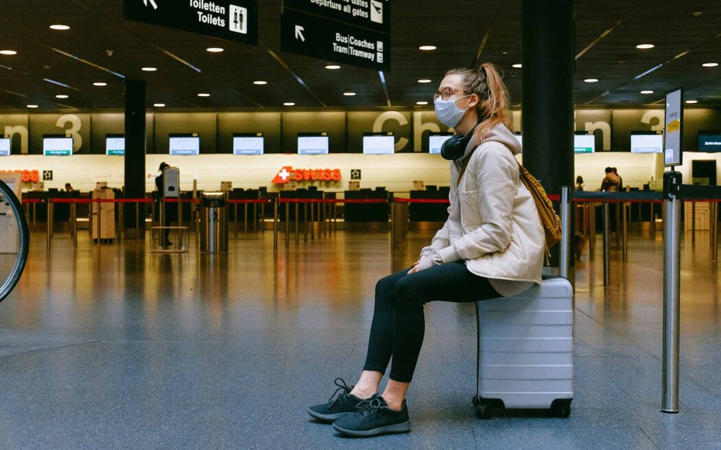 masqued-passenger-in-airport-2096