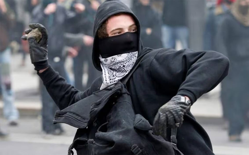 protestor-throwing-rock_1024