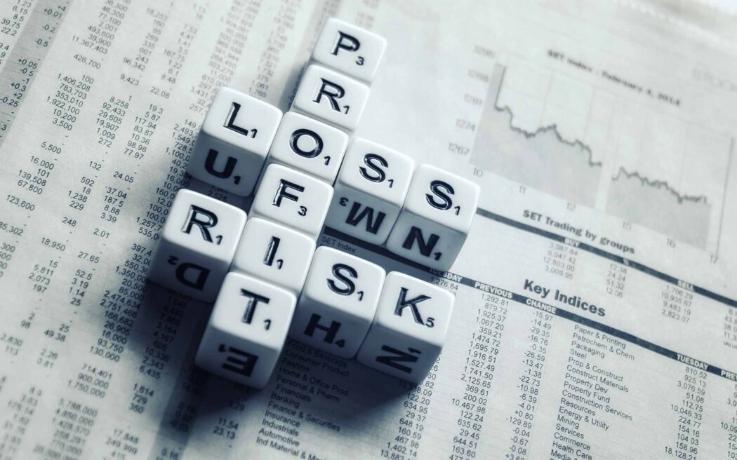 risk-dices-over-newspaper-2096